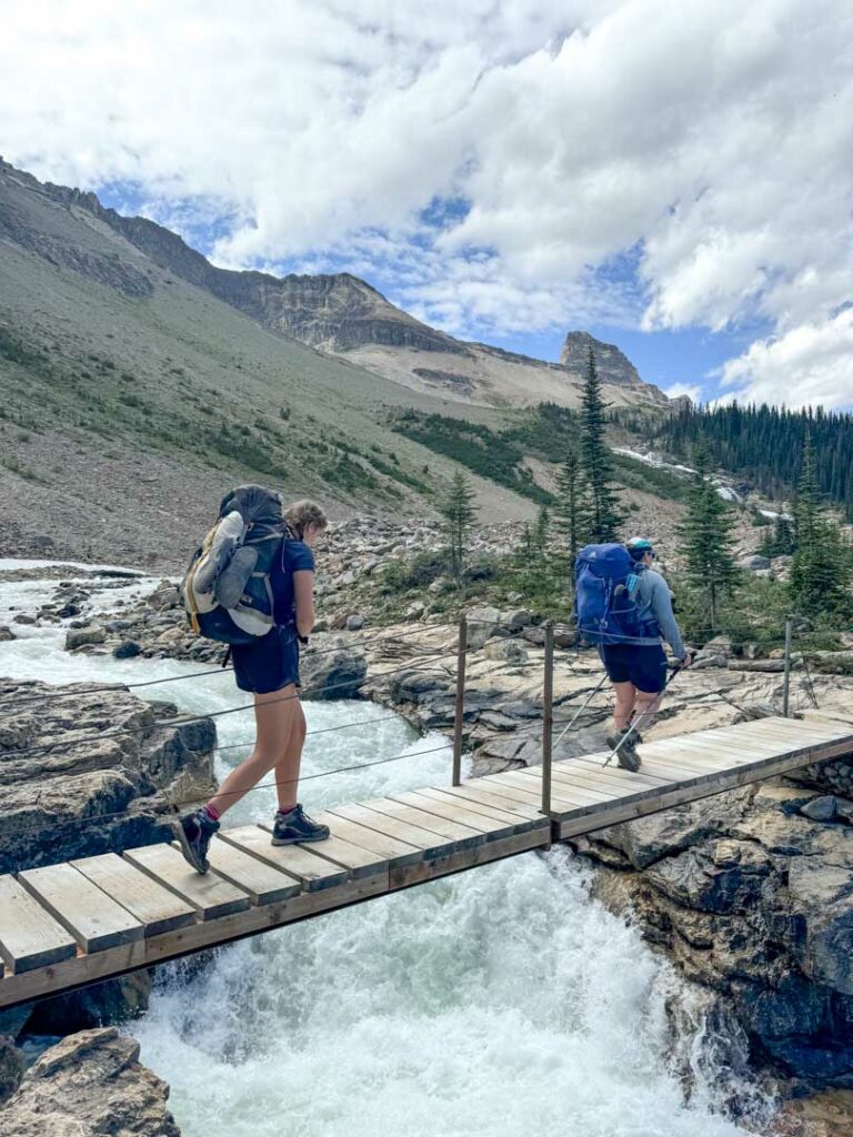 Hikers crossing the Whaleback Bridge in Yoho National Park.