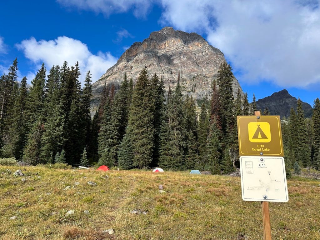 Tents in the Egypt Lake Campground with a sign in the foreground.