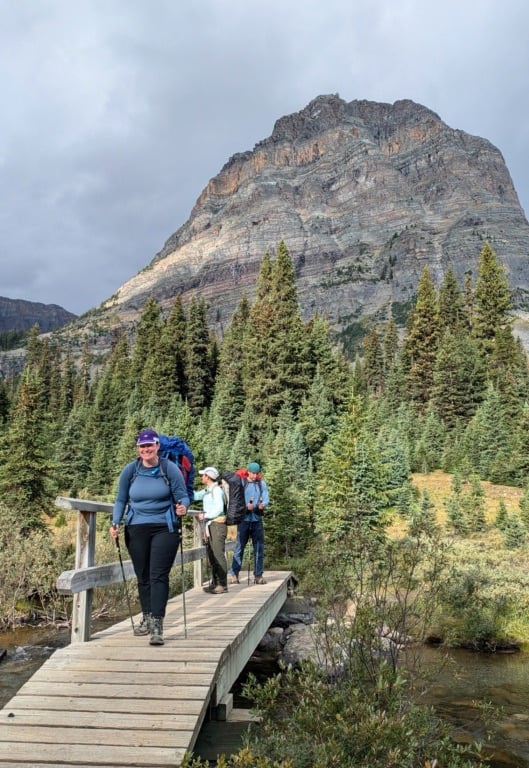 Hikers walk across the Pharaoh Creek bridge