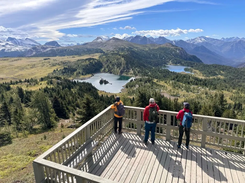 Hikers enjoy the views from the Standish Viewing Deck at Sunshine Village