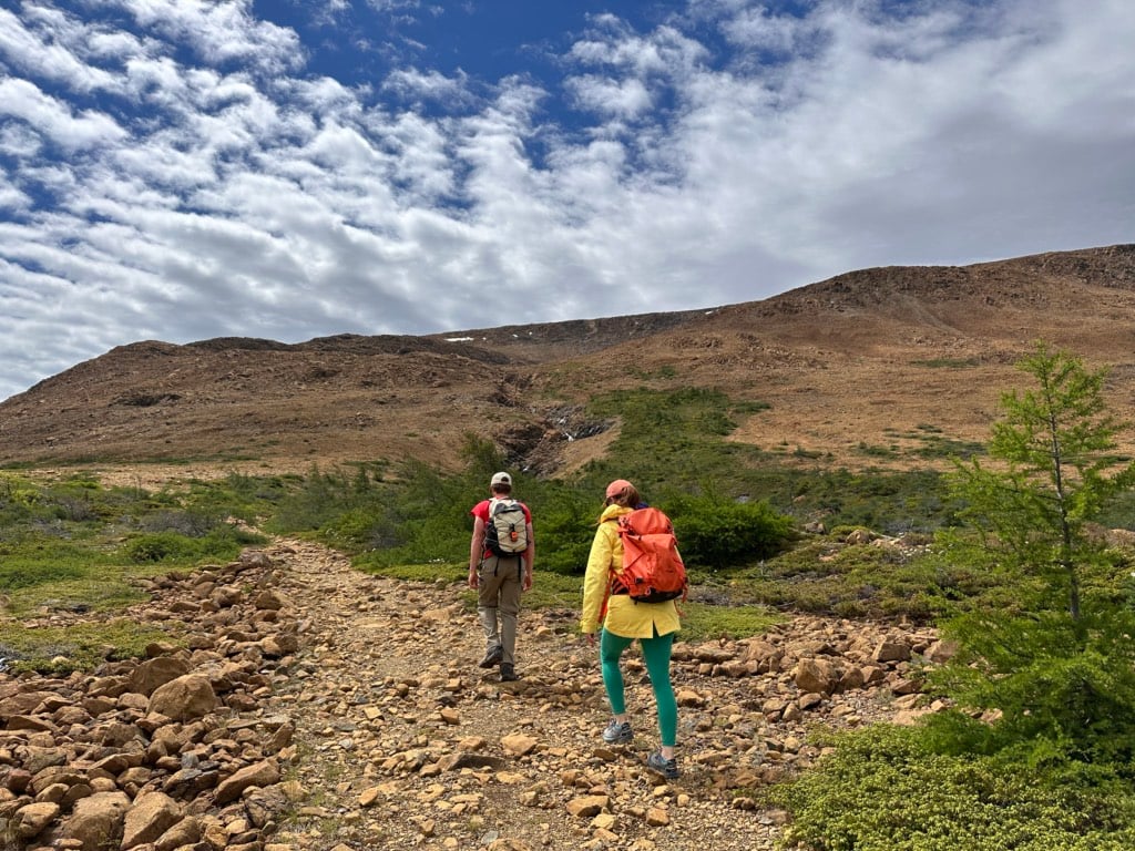 Two hikers walk on the Tablelands Trail