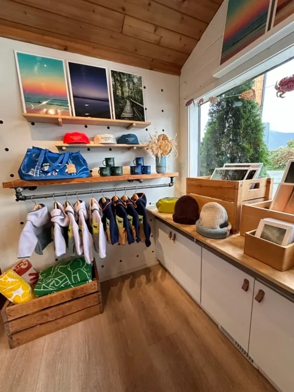 A display of art and clothing at Caravan Beach Shop