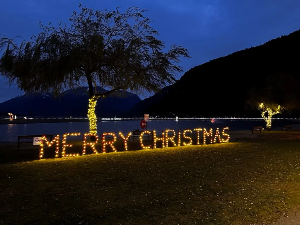 Lights spell out Merry Christmas at Lights by the Lake at Harrison Hot Springs in winter