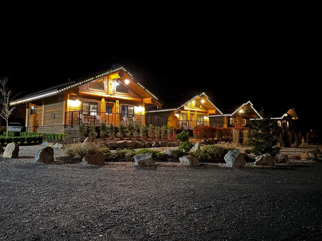 Cabins lit up at night at the Sandpiper Resort in Harrison