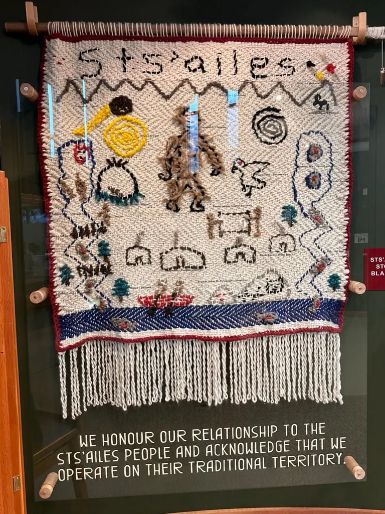 A Sts'ailes Nation weaving depicting the Sasquatch story