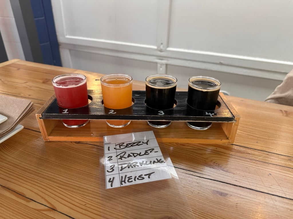 A flight of four small glasses of craft beer at Cannery Brewing.