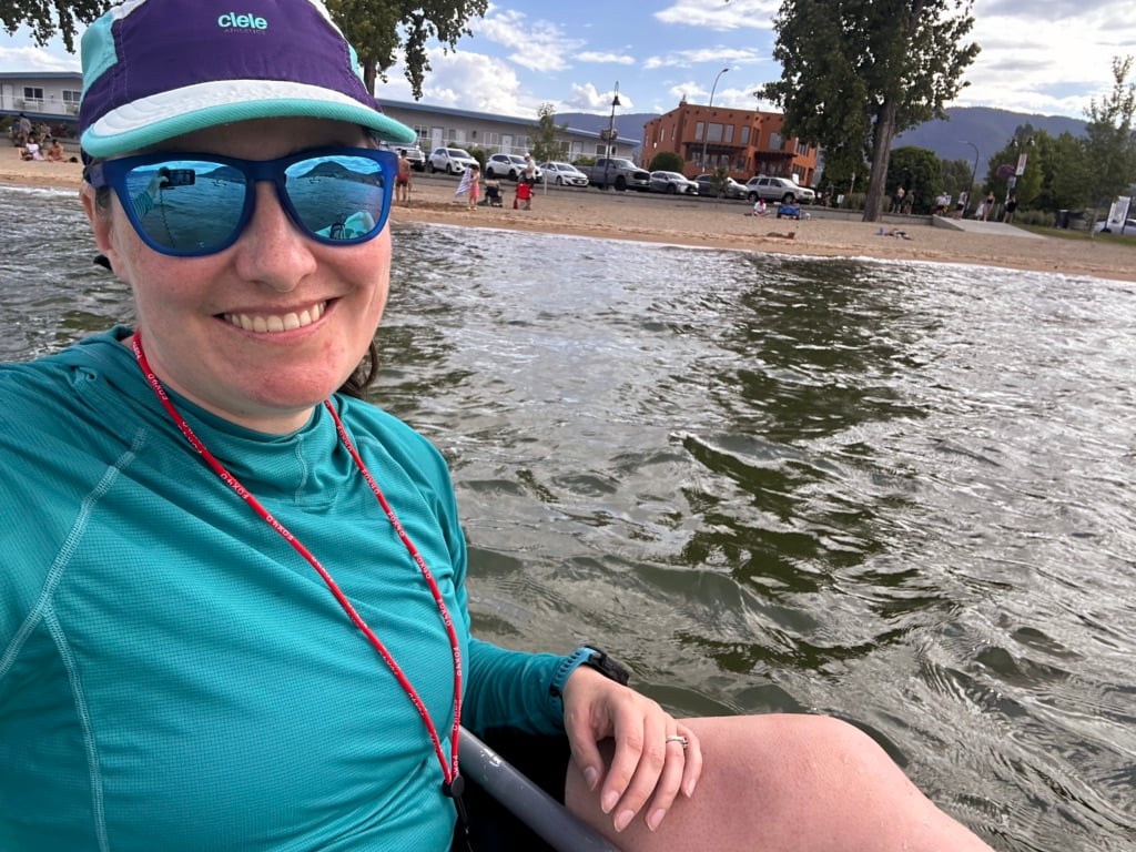 A woman takes a selfie in a kayak