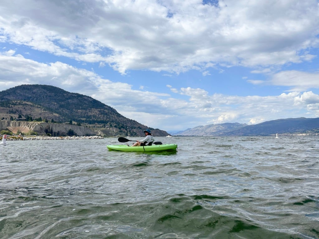 A woman kayaking on Okanagan Lake in Penticton