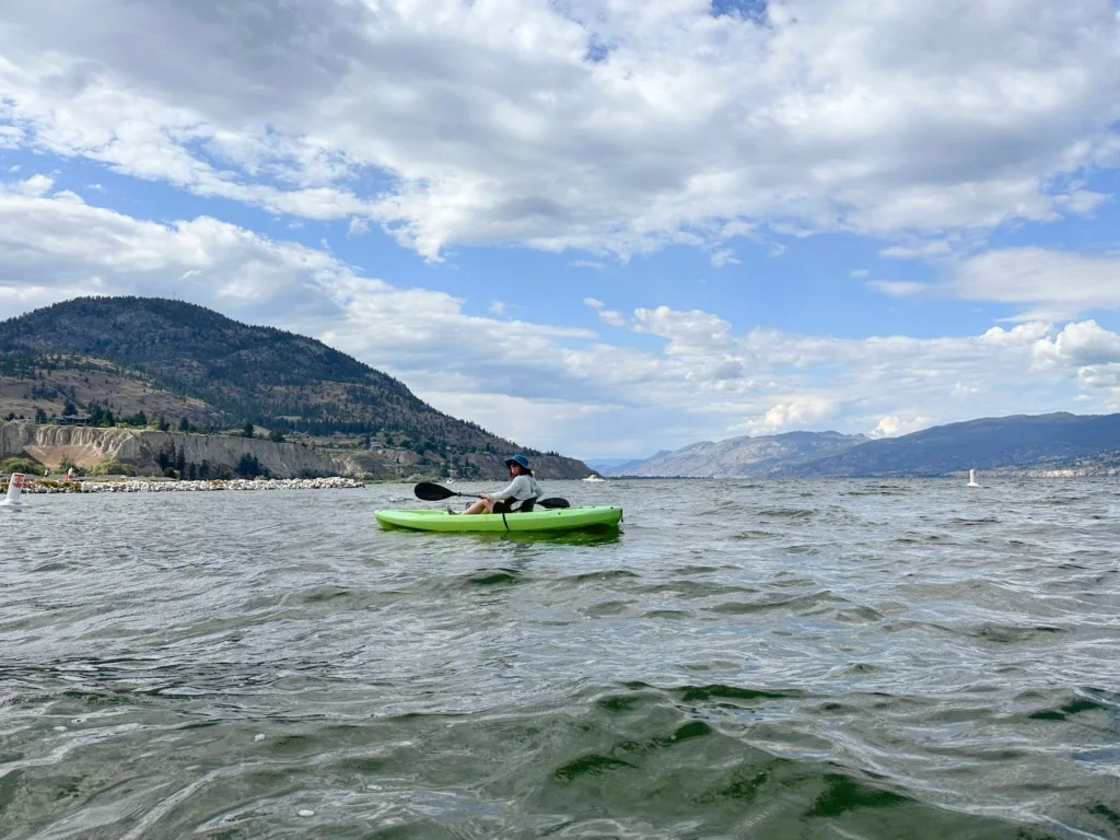 A woman kayaking on Okanagan Lake in Penticton