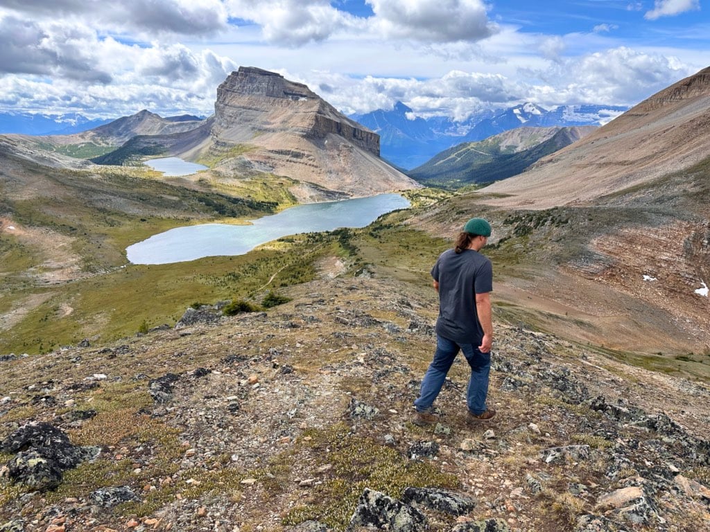 A hiker descends Packer's Pass Peak.