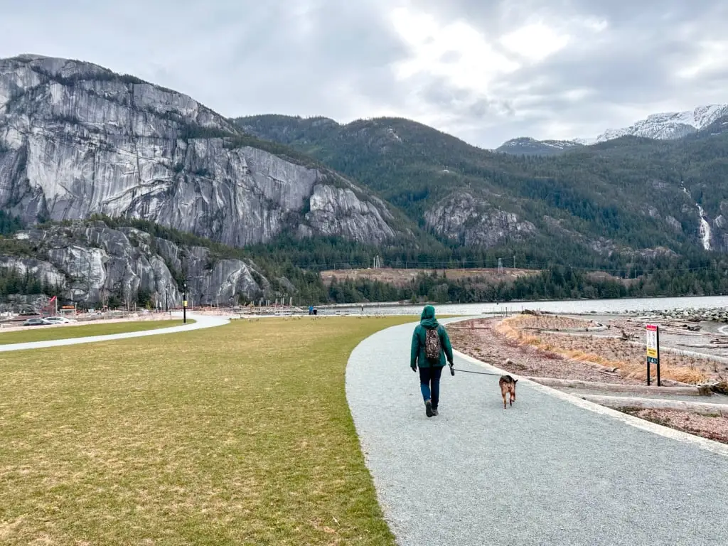 A dog walker at Sp'akw'us Feather Park