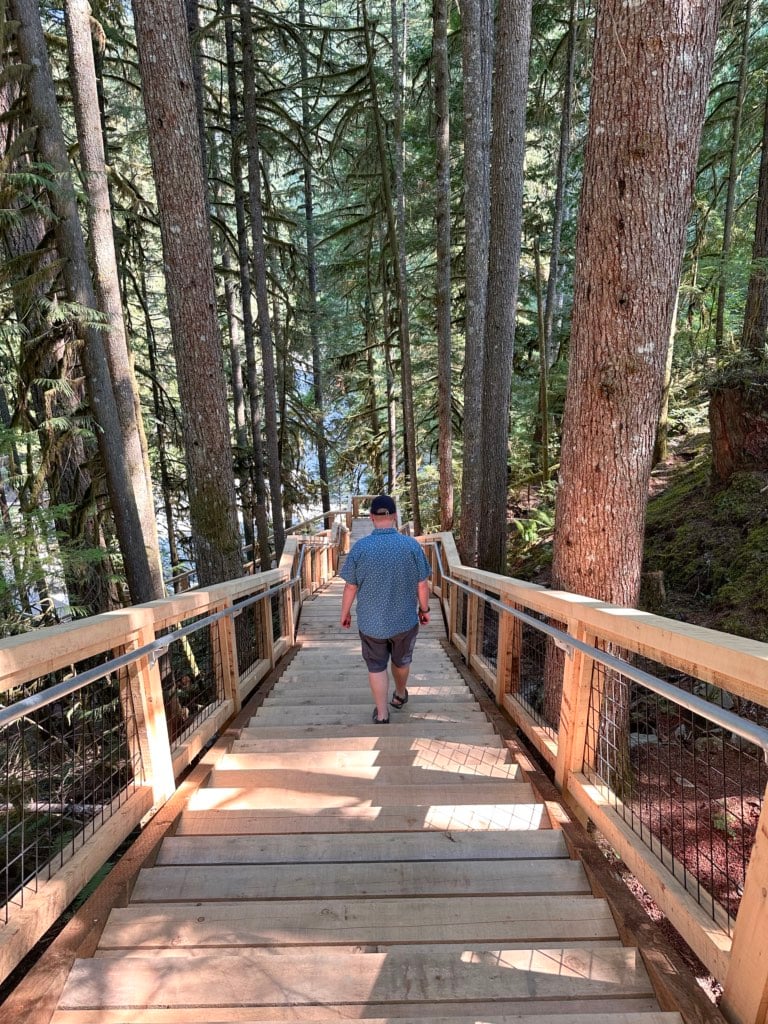 A man walks down the stairs at Squamish Canyon