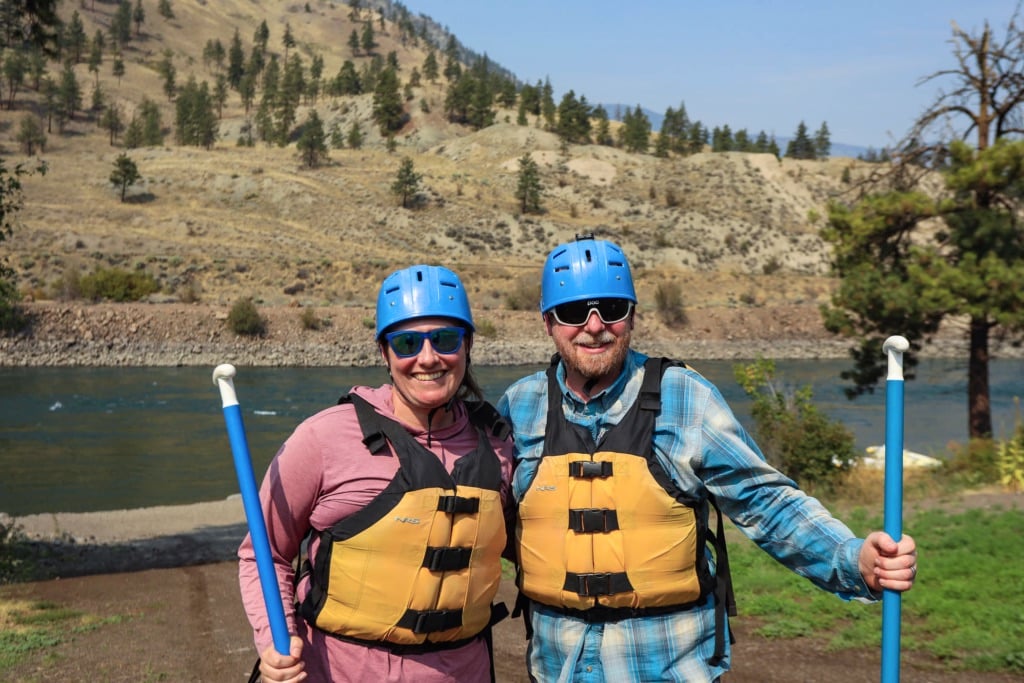 Two people pose before going rafting with Kumsheen Rafting