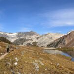 Two hikers walking along the trail to Russet Lake near Whistler