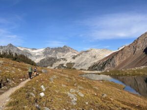 Two hikers walking along the trail to Russet Lake near Whistler