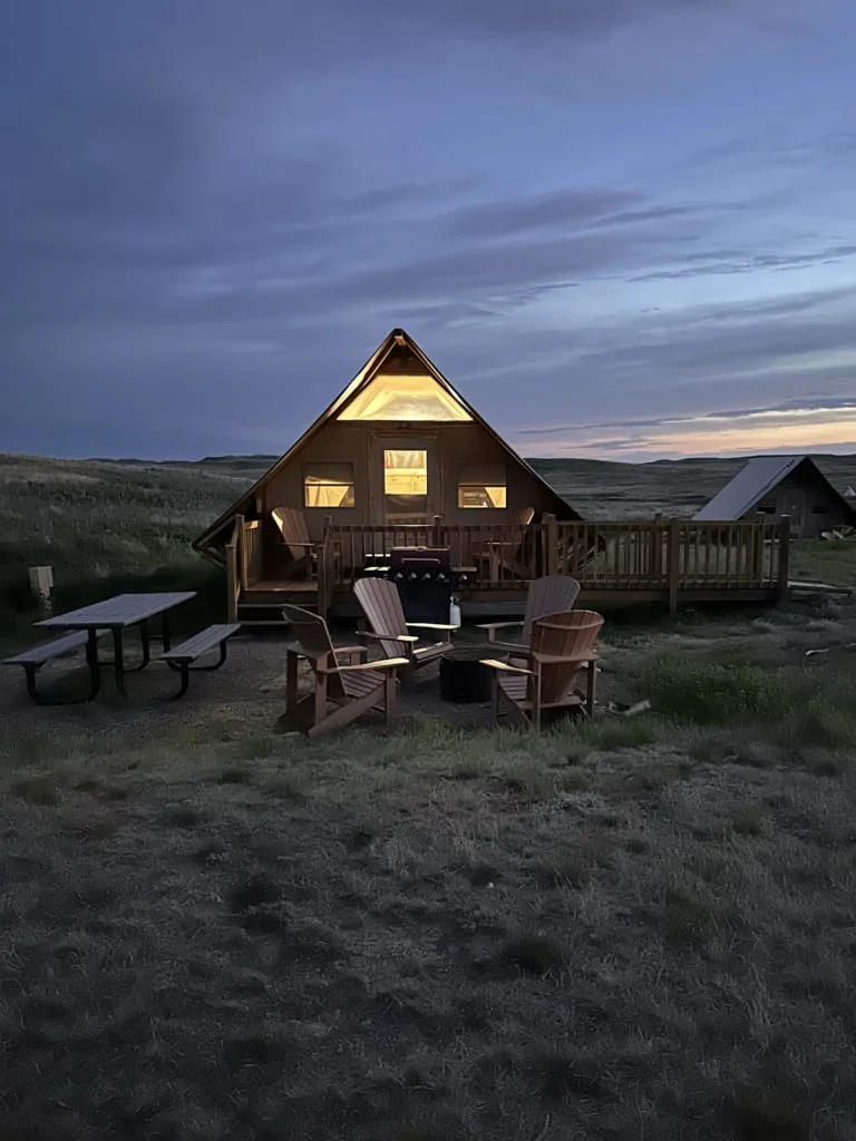 View of an oTENTik glamping tent at dusk in Grasslands National Park