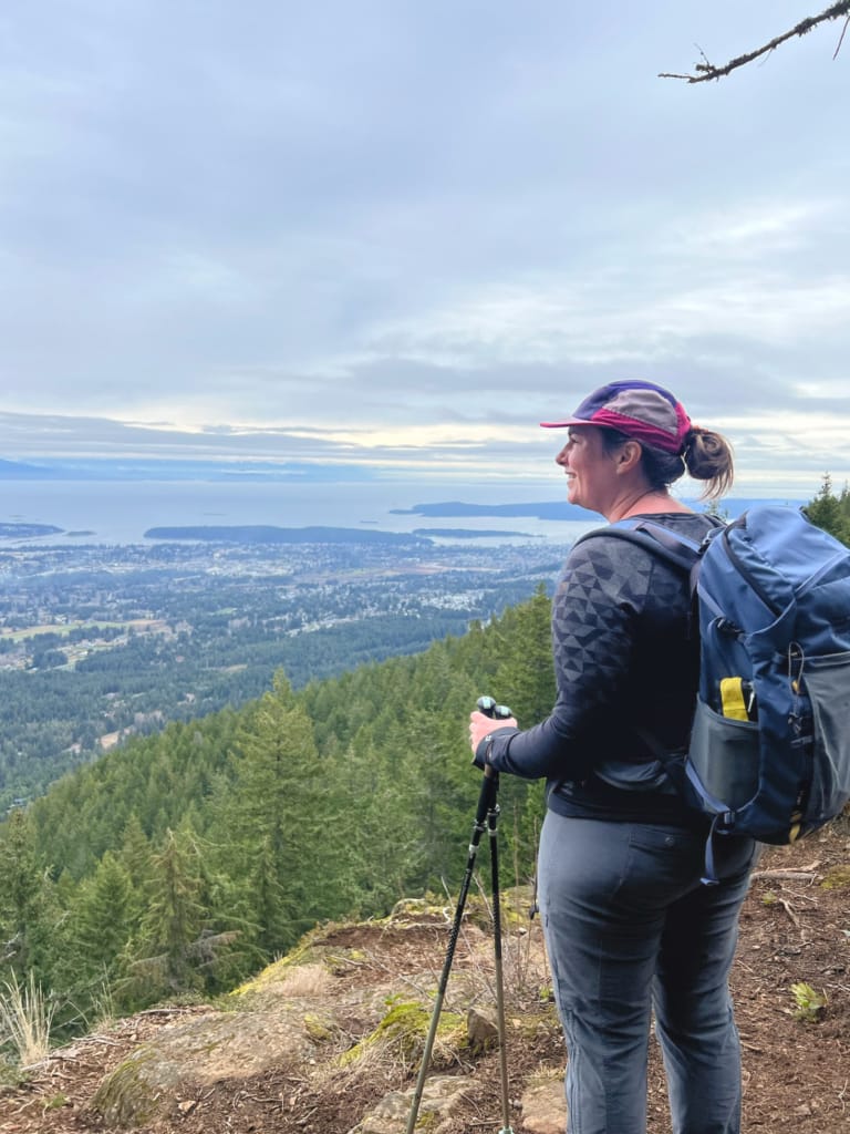 A hiker stands at a viewpoint on Mount Benson, one of the best things to do in Nanaimo
