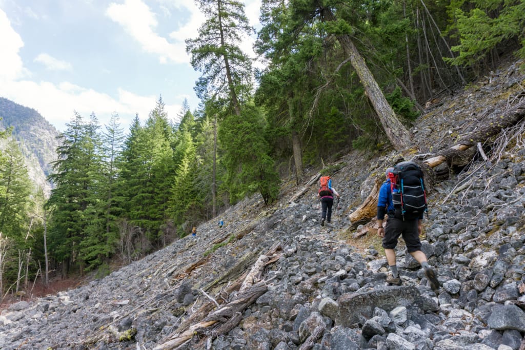 Hikers crossing the talus field on the Devil's Staircase in the Stein Valley