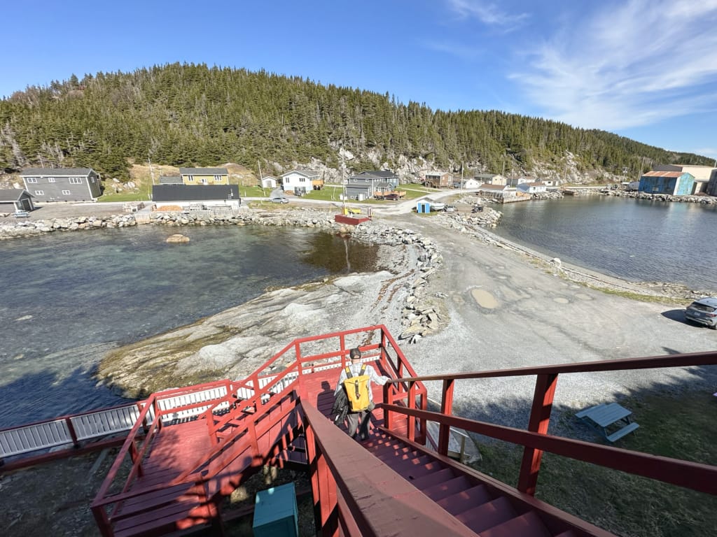 A hiker walks down the stairs at the Barr'd Island Trail in Englee, Newfoundland