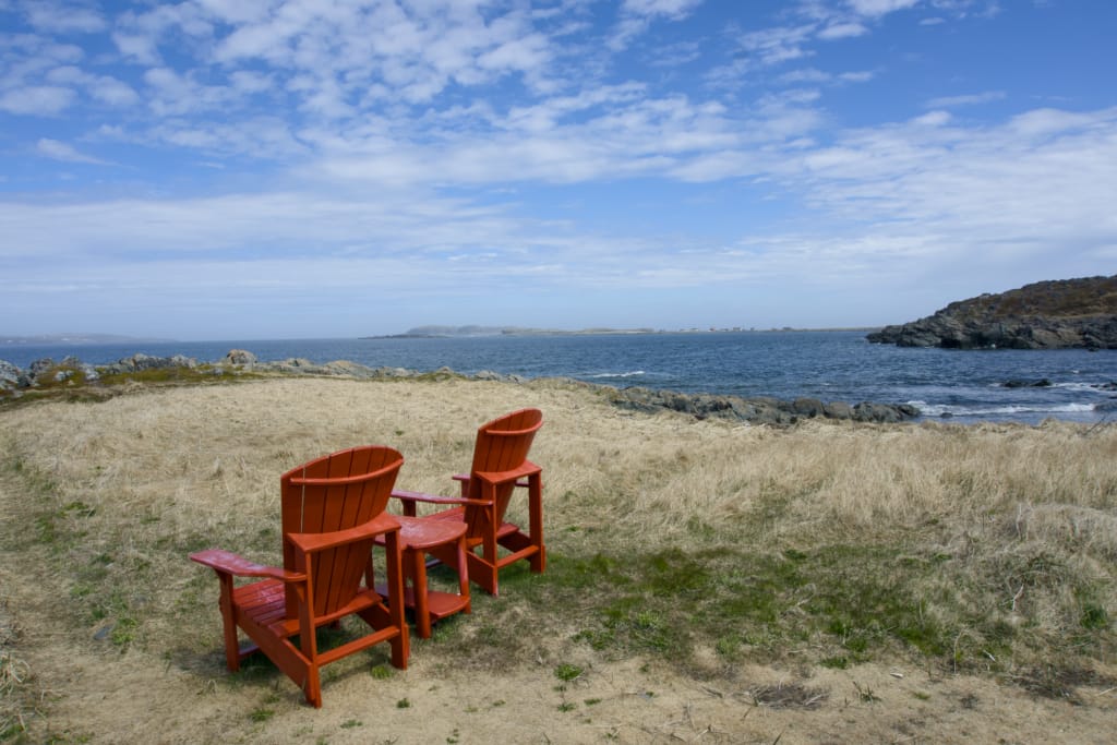 Parks Canada red chairs on the Birchy Nuddick Trail at L'Anse aux Meadows National Historic Site