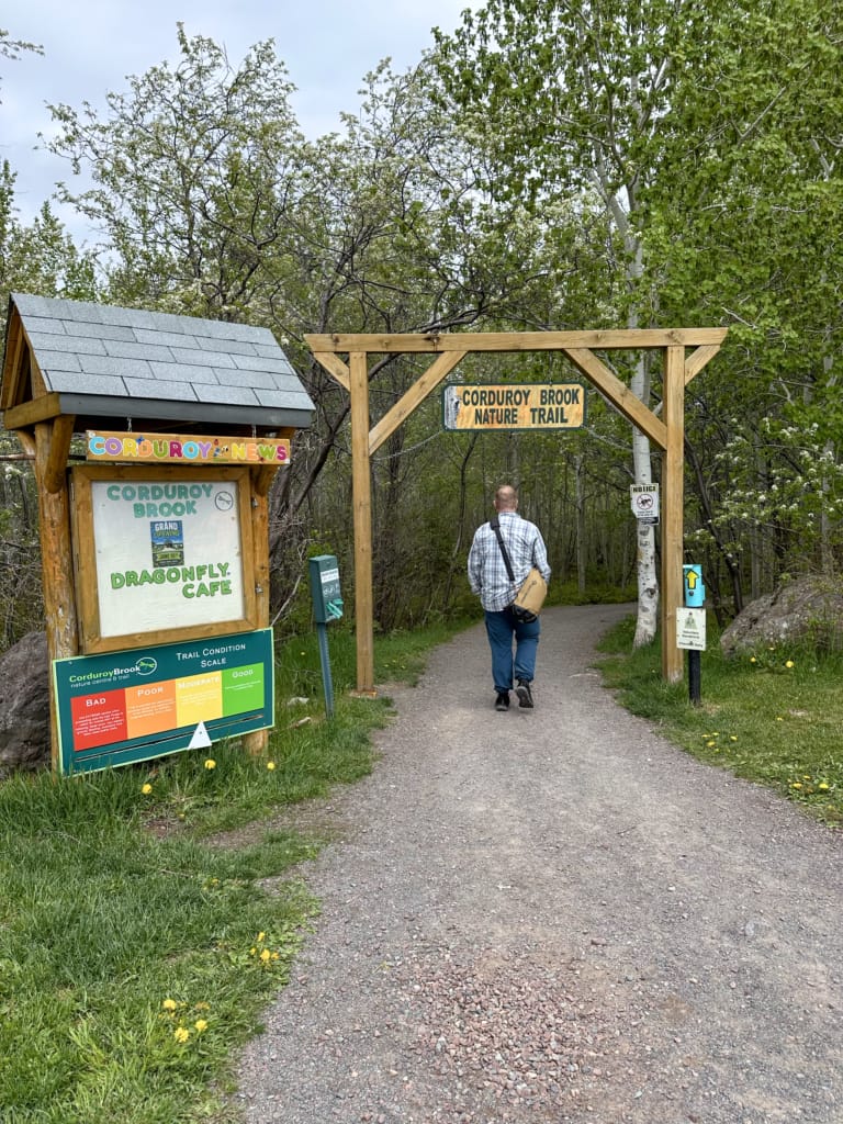 A man walks through the entrance gate at Corduory Brook Nature Trail in Grand Falls-Windsor, Newfoundland