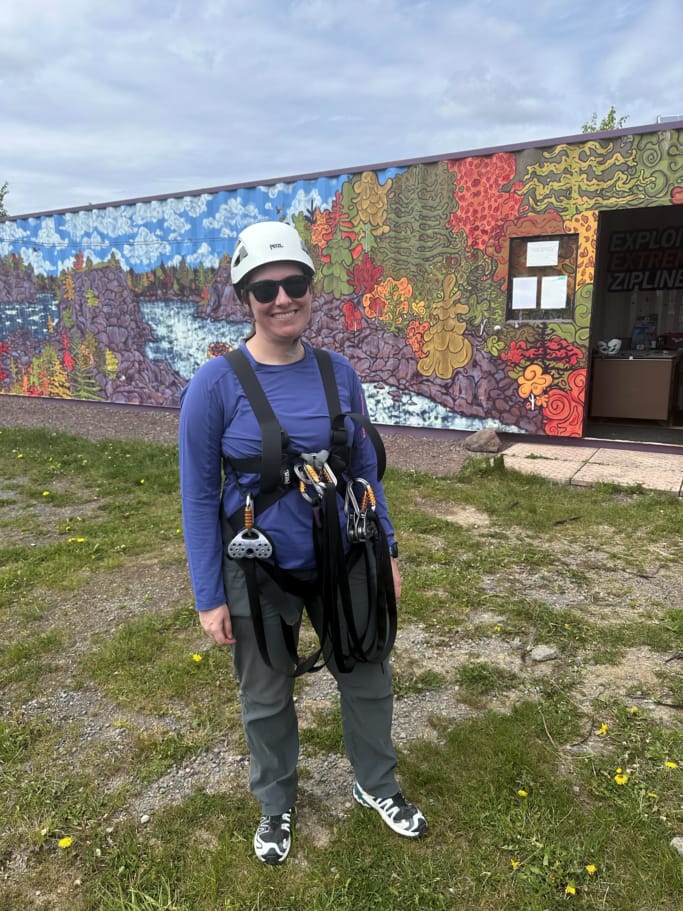 A woman getting geared up to go ziplinging at Exploits Extreme Ziplines in Grand Falls, Windsor