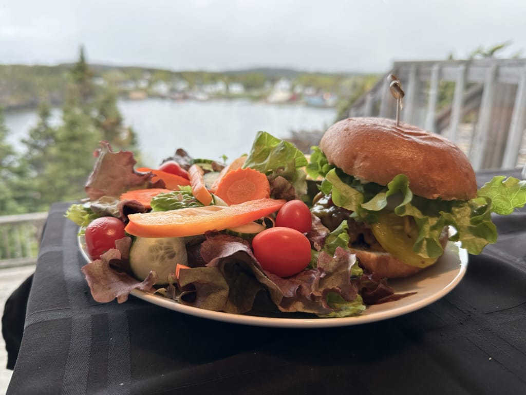 A burger and salad at Chucky's Restaurant at the Happy Adventure Inn