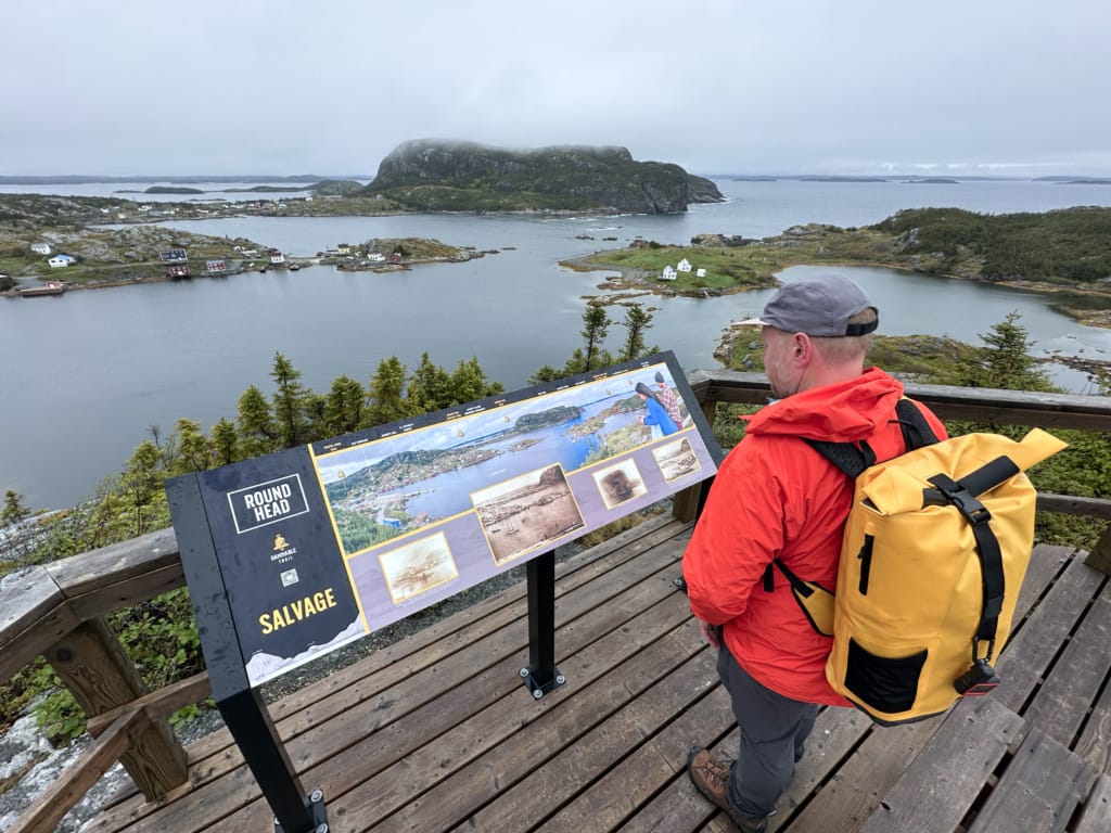 A hiker at the Round Head viewpoint on the Damnable Trails on the Easport Peninsula