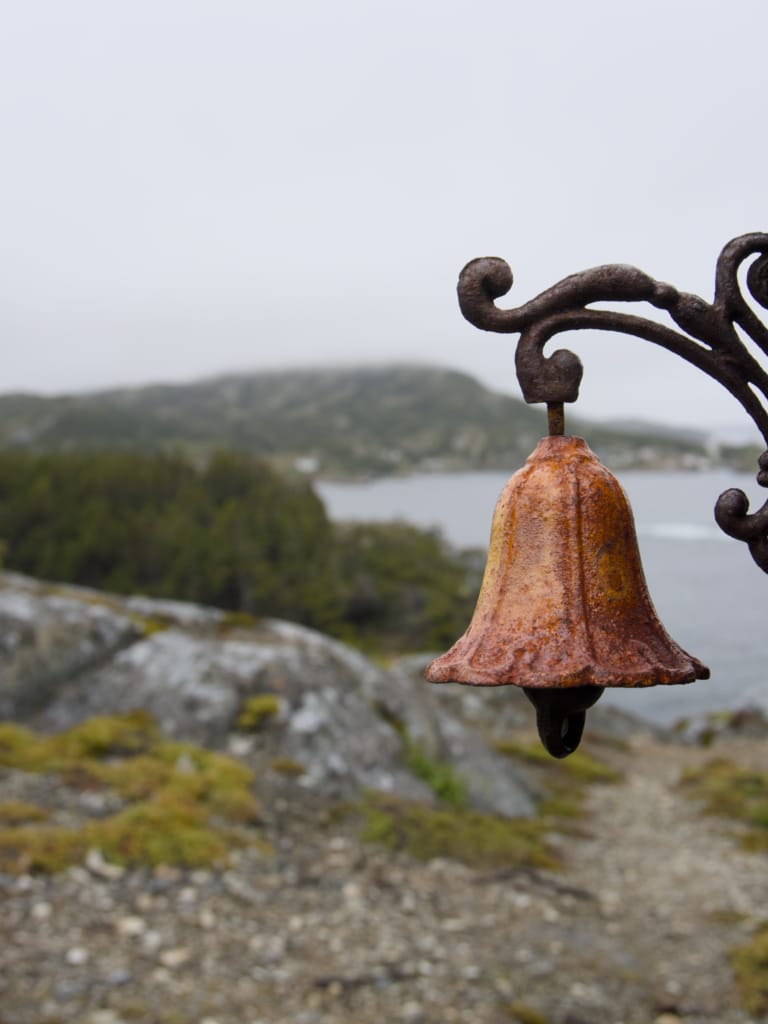 A close-up of a bell on the Damnable Trails on the Eastport Peninsula in Newfoundland
