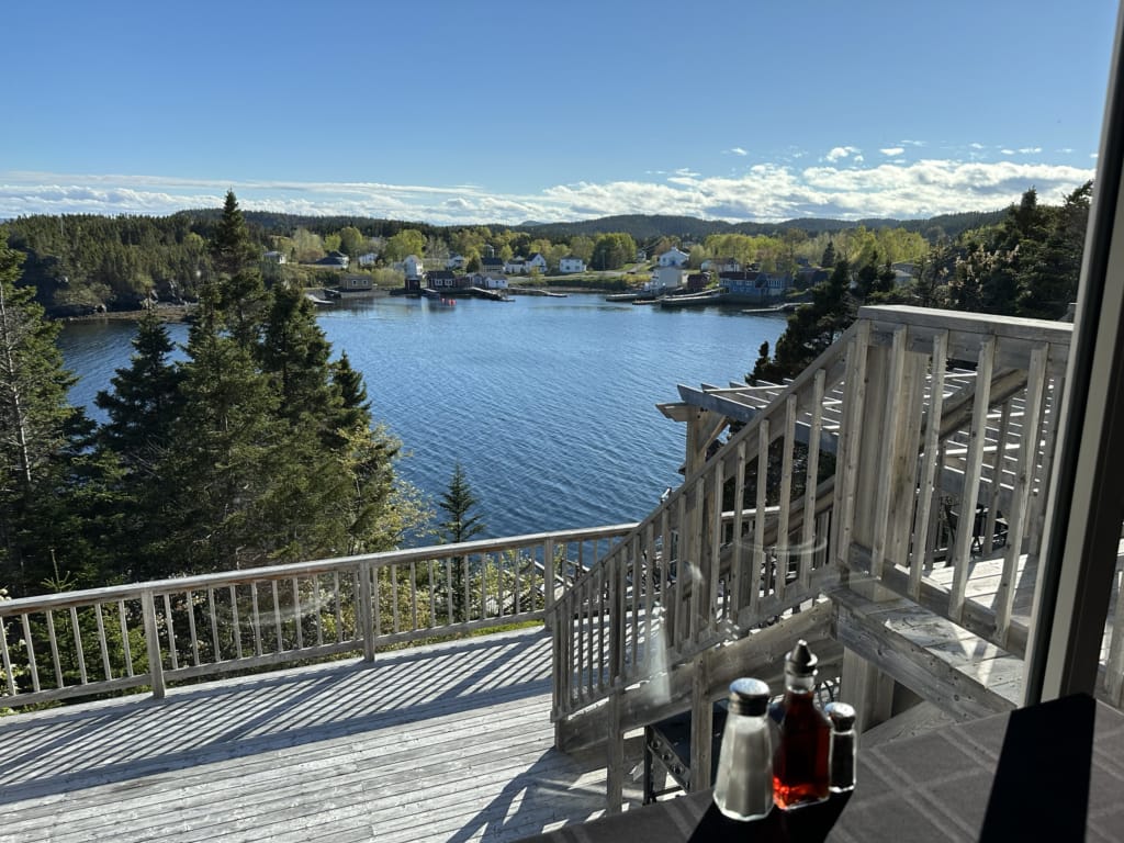 The view of the ocean from the deck at the Happy Adventure Inn