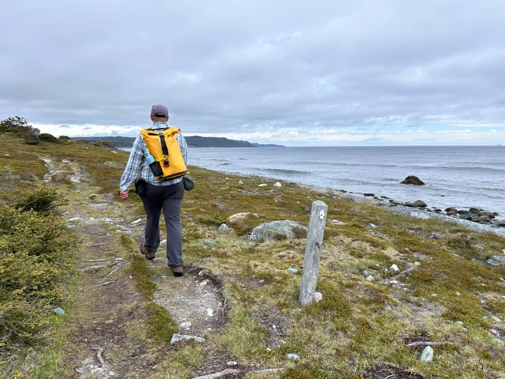 A hiker on the East Coast Trail near Cappahayden, Newfoundland