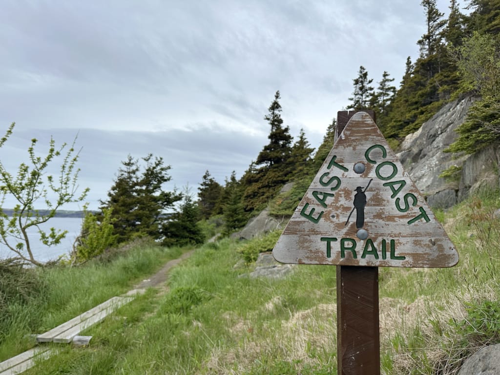 A wooden East Coast Trail sign near St. Phillips, Newfoundland