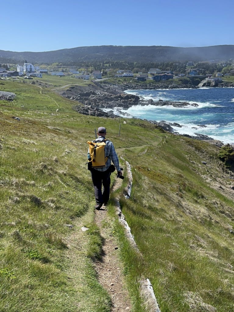 A hiker following the East Coast Trail towards Pouch Cove, NL