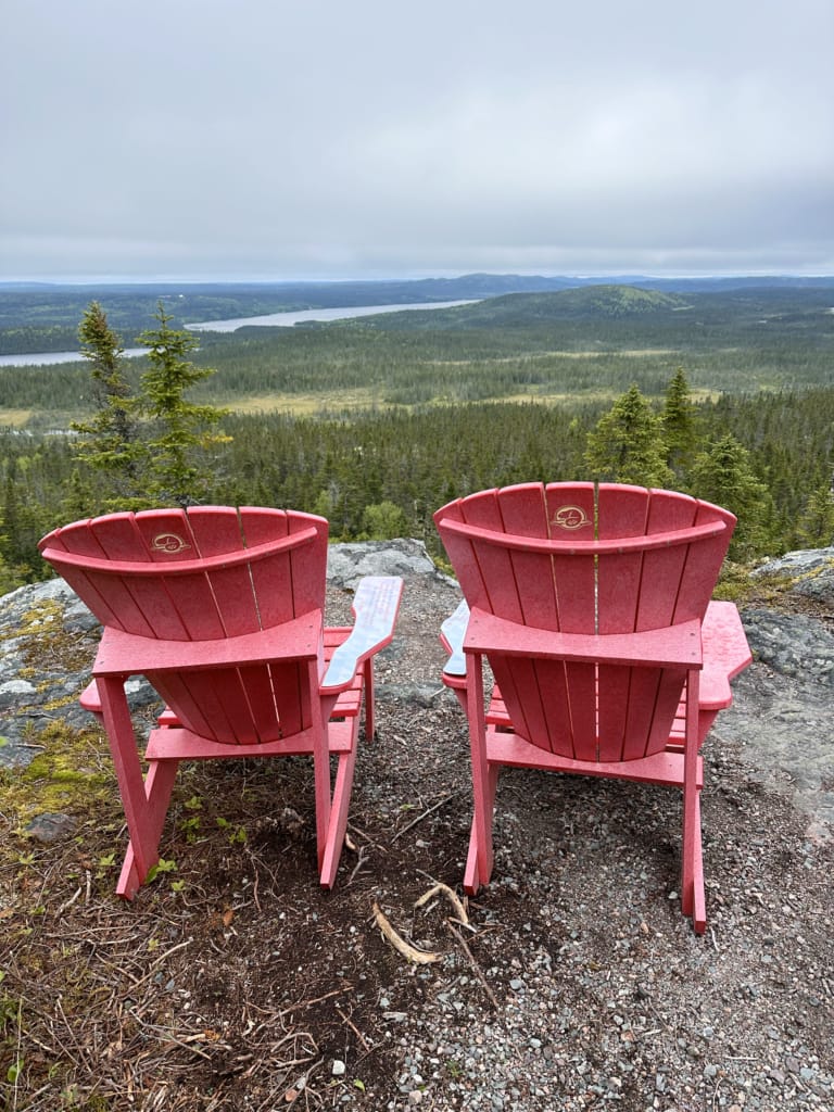 Parks Canada red chairs at the Ochre Hill Trail in Terra Nova National Park
