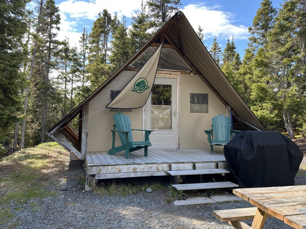 The exterior of an oTENTik canvas tent cabin at Terra Nova National Park