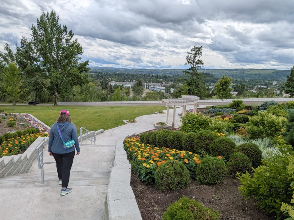 A woman walks along a path in Connaught HIll Park in Prince George