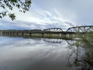 Railway bridge over the Fraser River. Walking the trails from Cottonwood Island to see the bridge is one of the best things to do in Prince George